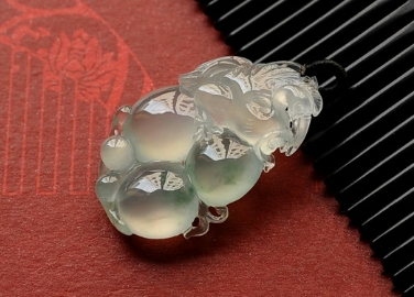 Carved-White-Jade-Pendant-with-Intricate-Natural-Design